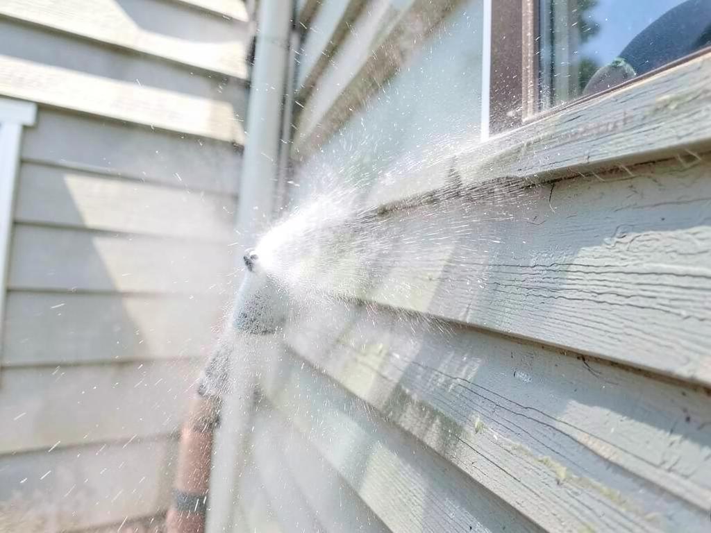 Pressure washing siding before painting
